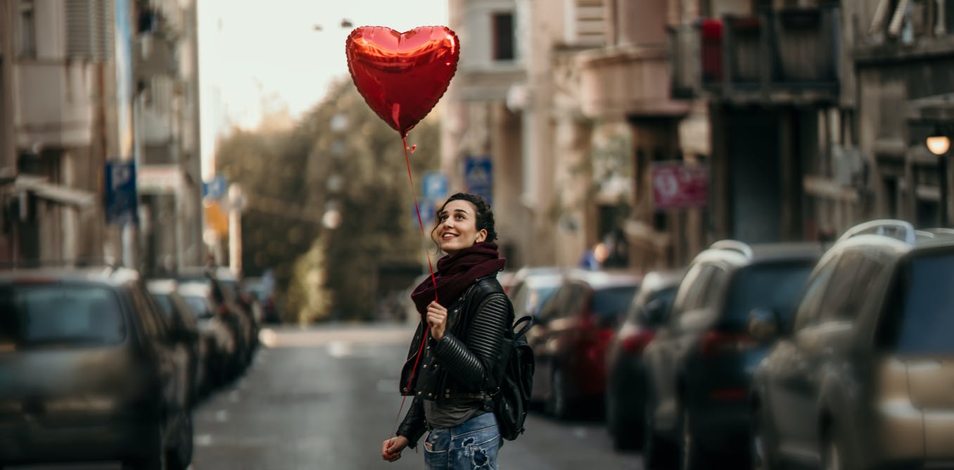 A person walking down a busy city street
