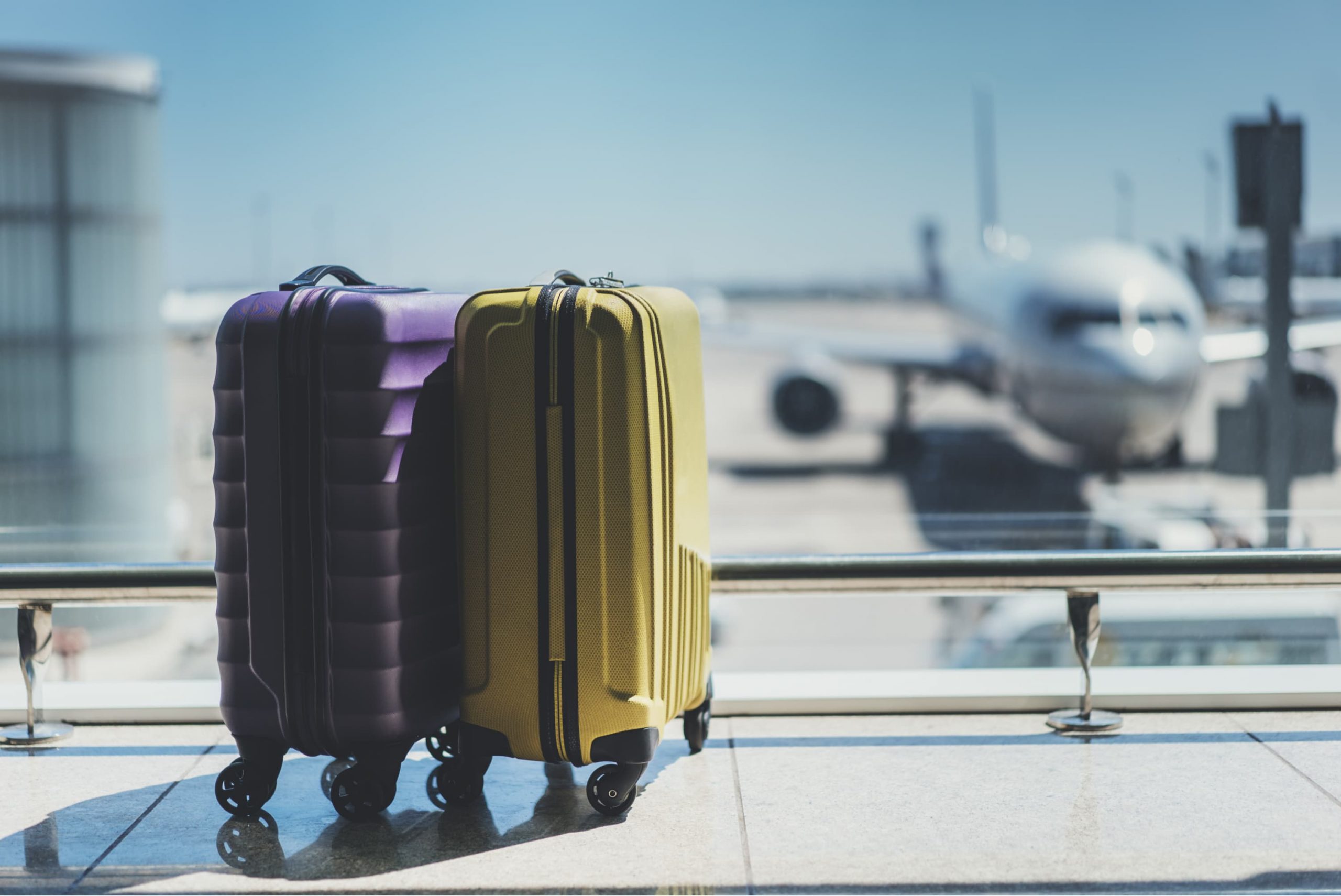 A plane sitting on top of a suitcase